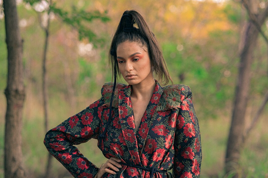 Portrait of a smiling Brazilian woman in a blazer