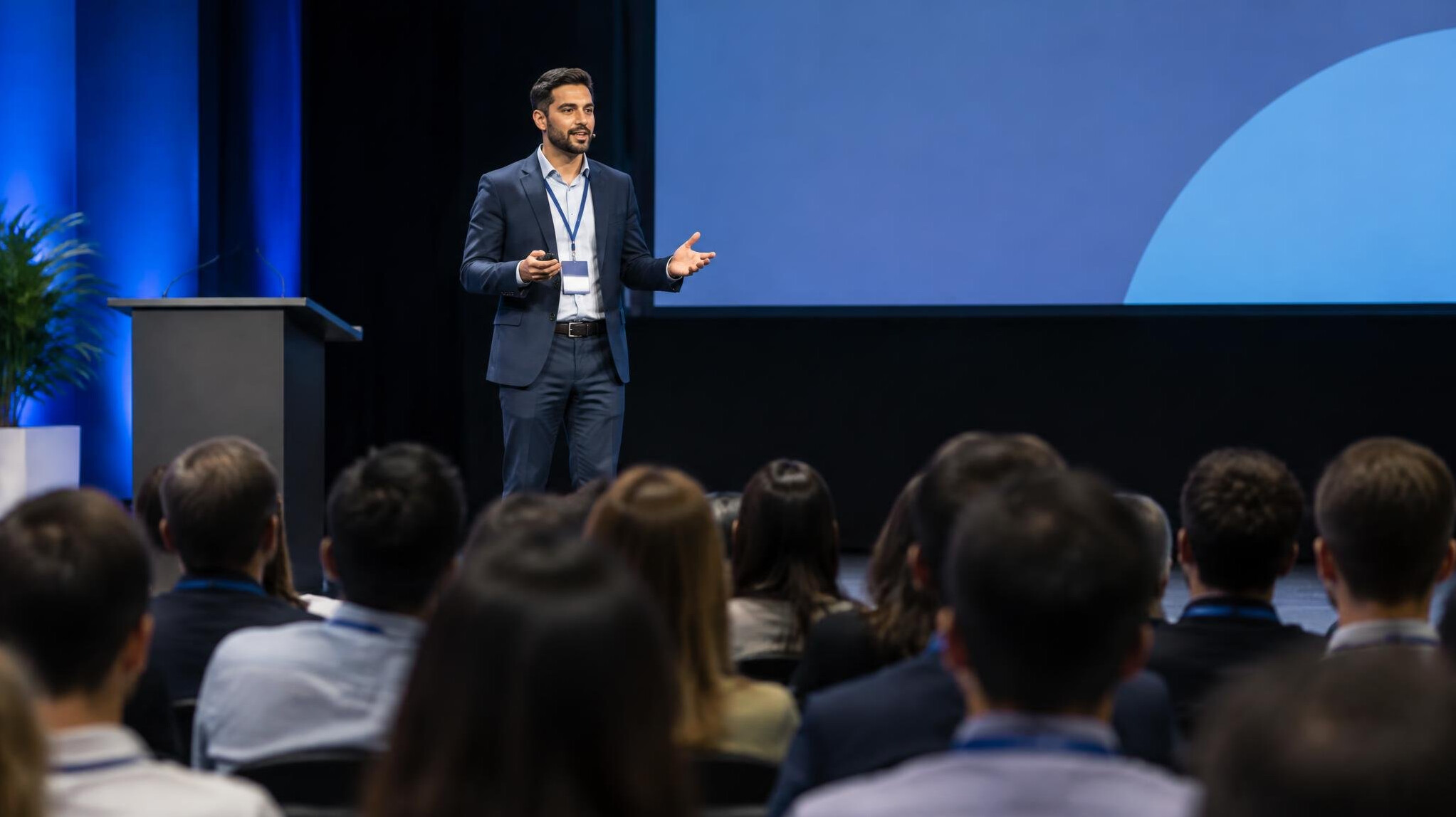 person giving speech on stage